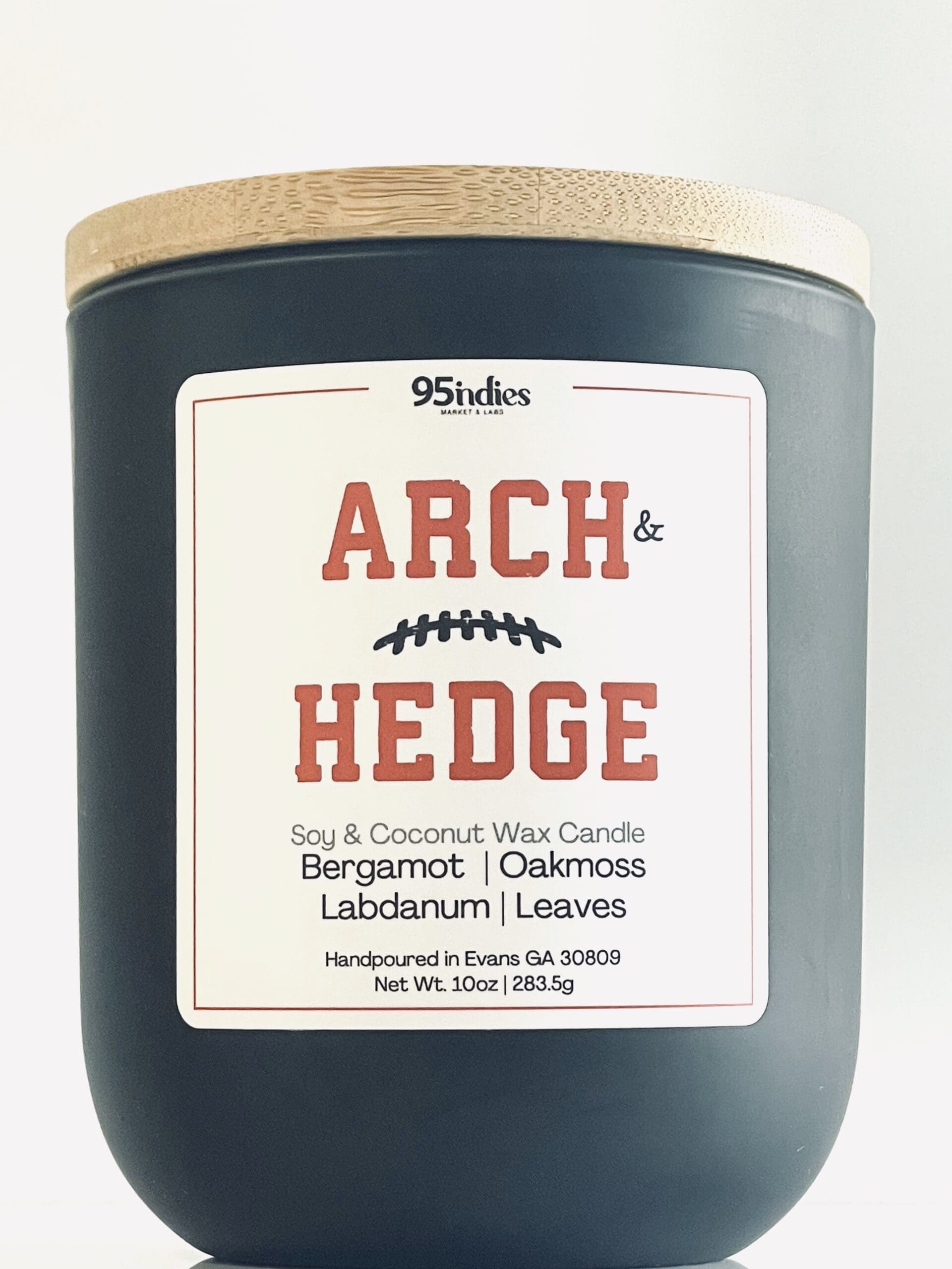 Arch & Hedge 10oz Artisan Candle – Perfect for game days, tailgating, and elegant evenings at home. Arch & Hedge 10oz soy and coconut wax candle with matte black jar, bamboo lid, and rich fragrance notes of bergamot, oakmoss, labdanum, and leaves.