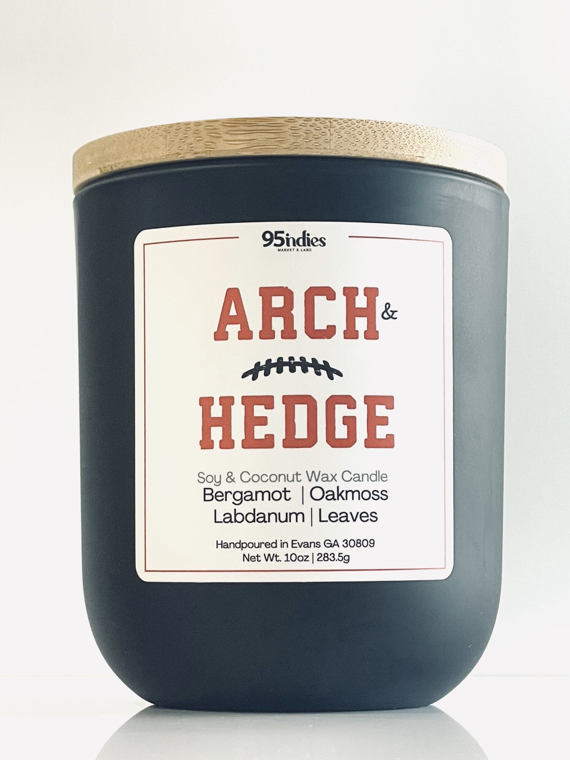 Arch & Hedge 10oz Artisan Candle – Perfect for game days, tailgating, and elegant evenings at home. Arch & Hedge 10oz soy and coconut wax candle with matte black jar, bamboo lid, and rich fragrance notes of bergamot, oakmoss, labdanum, and leaves.