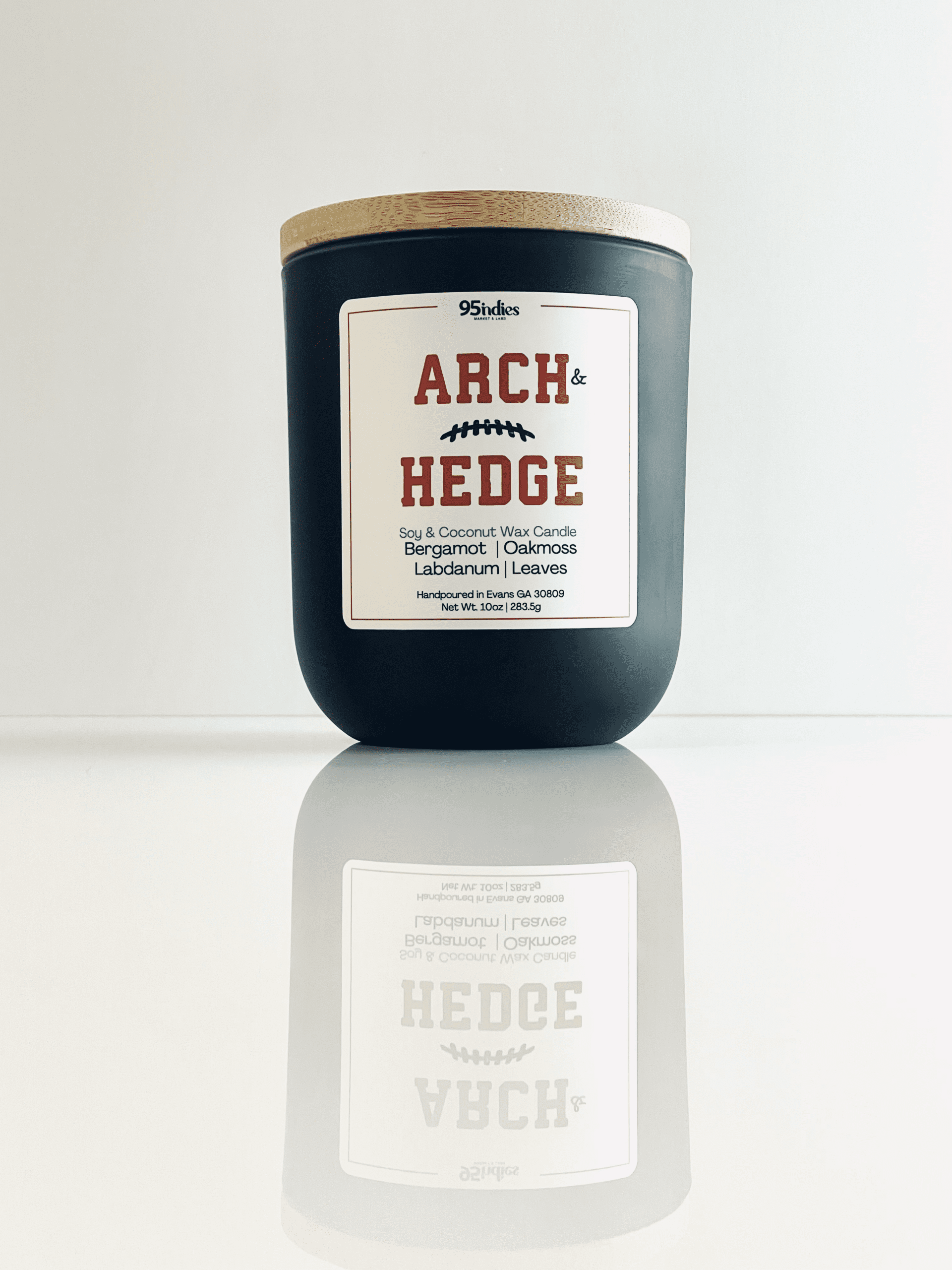 Arch & Hedge 10oz Artisan Candle – Perfect for game days, tailgating, and elegant evenings at home. Arch & Hedge 10oz soy and coconut wax candle with matte black jar, bamboo lid, and rich fragrance notes of bergamot, oakmoss, labdanum, and leaves.