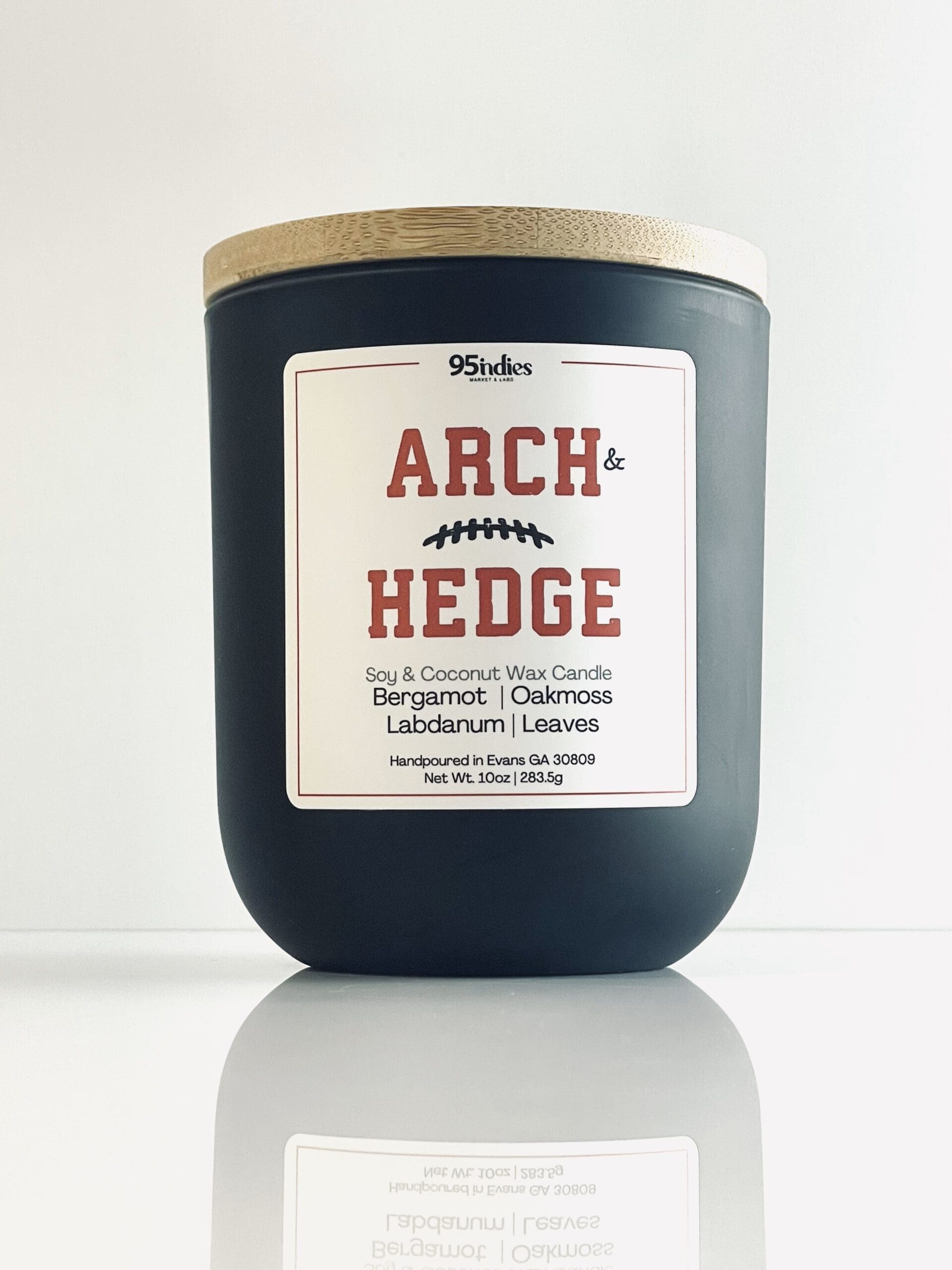 Arch & Hedge 10oz Artisan Candle – Perfect for game days, tailgating, and elegant evenings at home. Arch & Hedge 10oz soy and coconut wax candle with matte black jar, bamboo lid, and rich fragrance notes of bergamot, oakmoss, labdanum, and leaves.