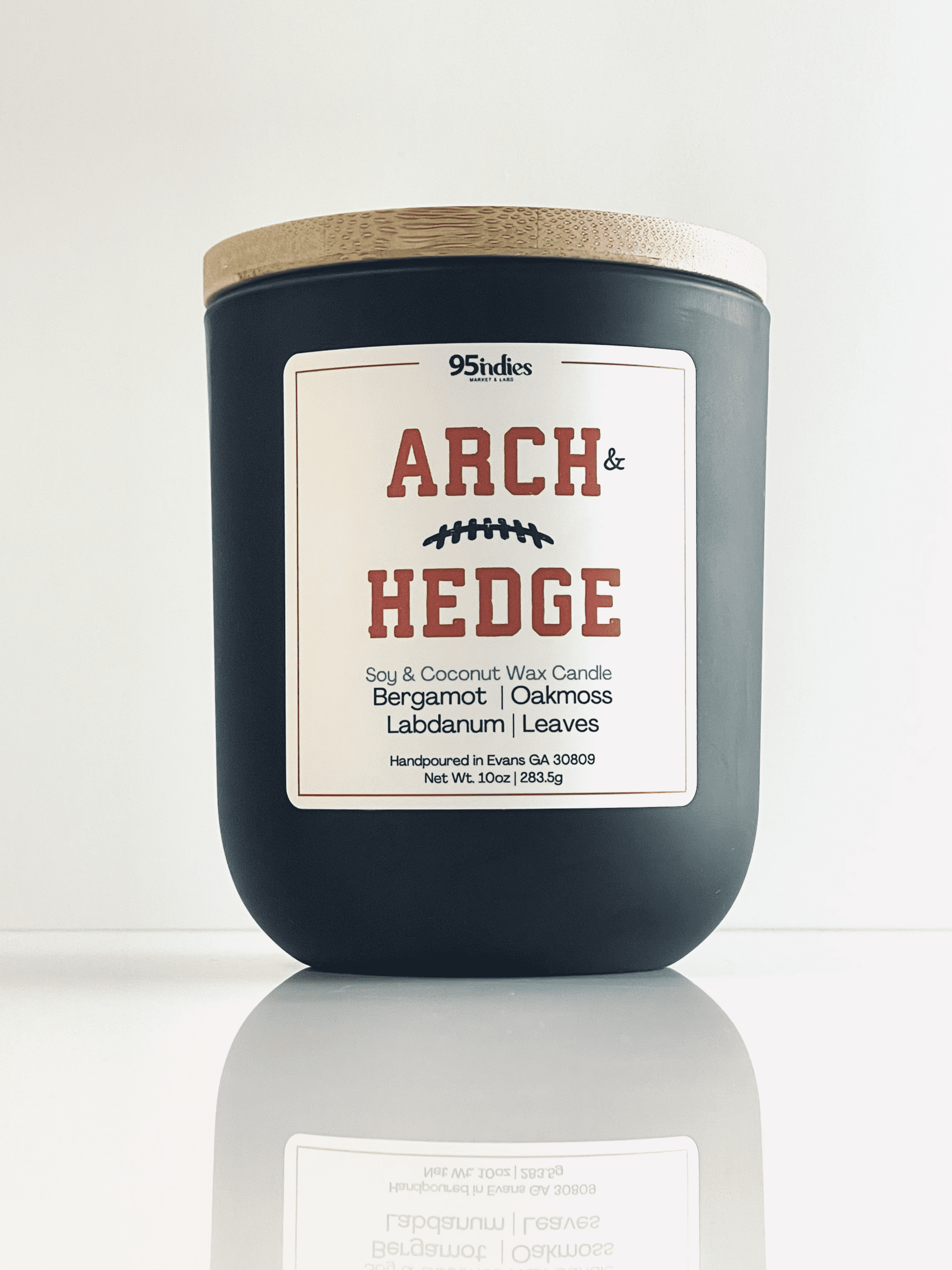 Arch & Hedge 10oz Artisan Candle – Perfect for game days, tailgating, and elegant evenings at home. Arch & Hedge 10oz soy and coconut wax candle with matte black jar, bamboo lid, and rich fragrance notes of bergamot, oakmoss, labdanum, and leaves.