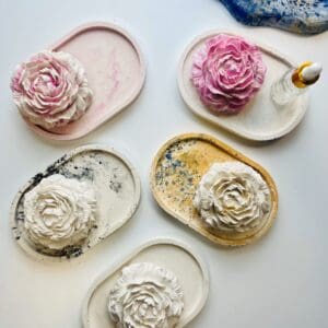 Handmade Jesmonite trays with floral toppers in assorted colors, perfect for Mother's Day gifting.