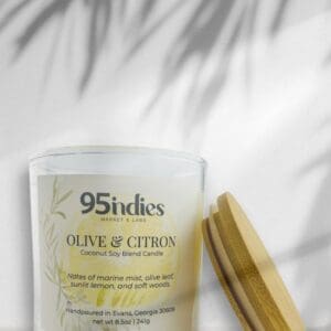 Ivory Olive & Citron candle with bamboo lid, soft palm shadows, and citron-toned label complete with olive leaves