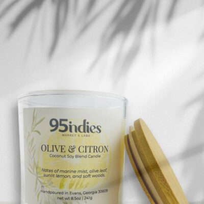 Ivory Olive & Citron candle with bamboo lid, soft palm shadows, and citron-toned label complete with olive leaves