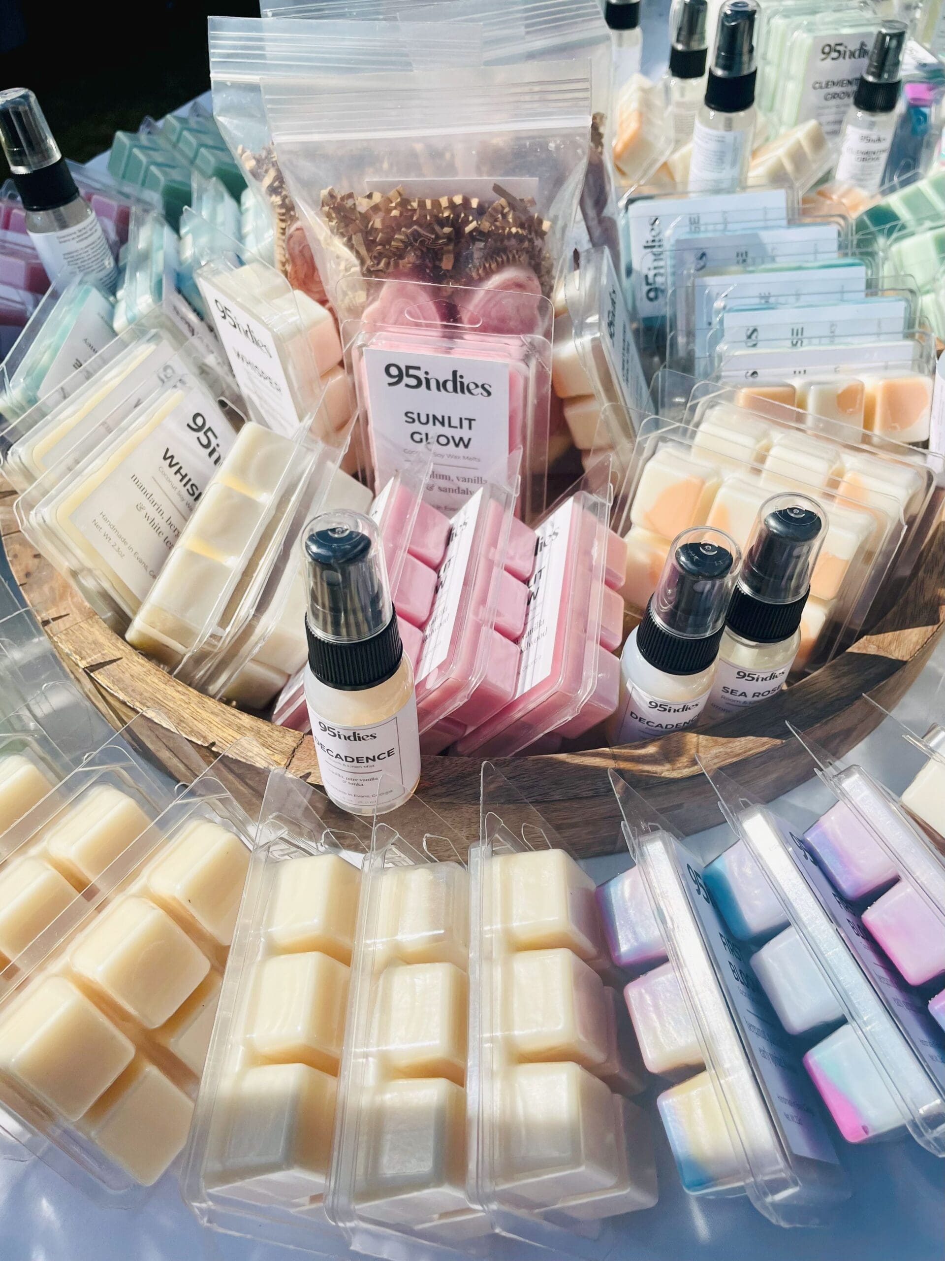 A colorful display of 95indies wax melts hand-poured in Evans, Georgia Assorted 95indies hand-poured soy wax melts displayed in a round basket