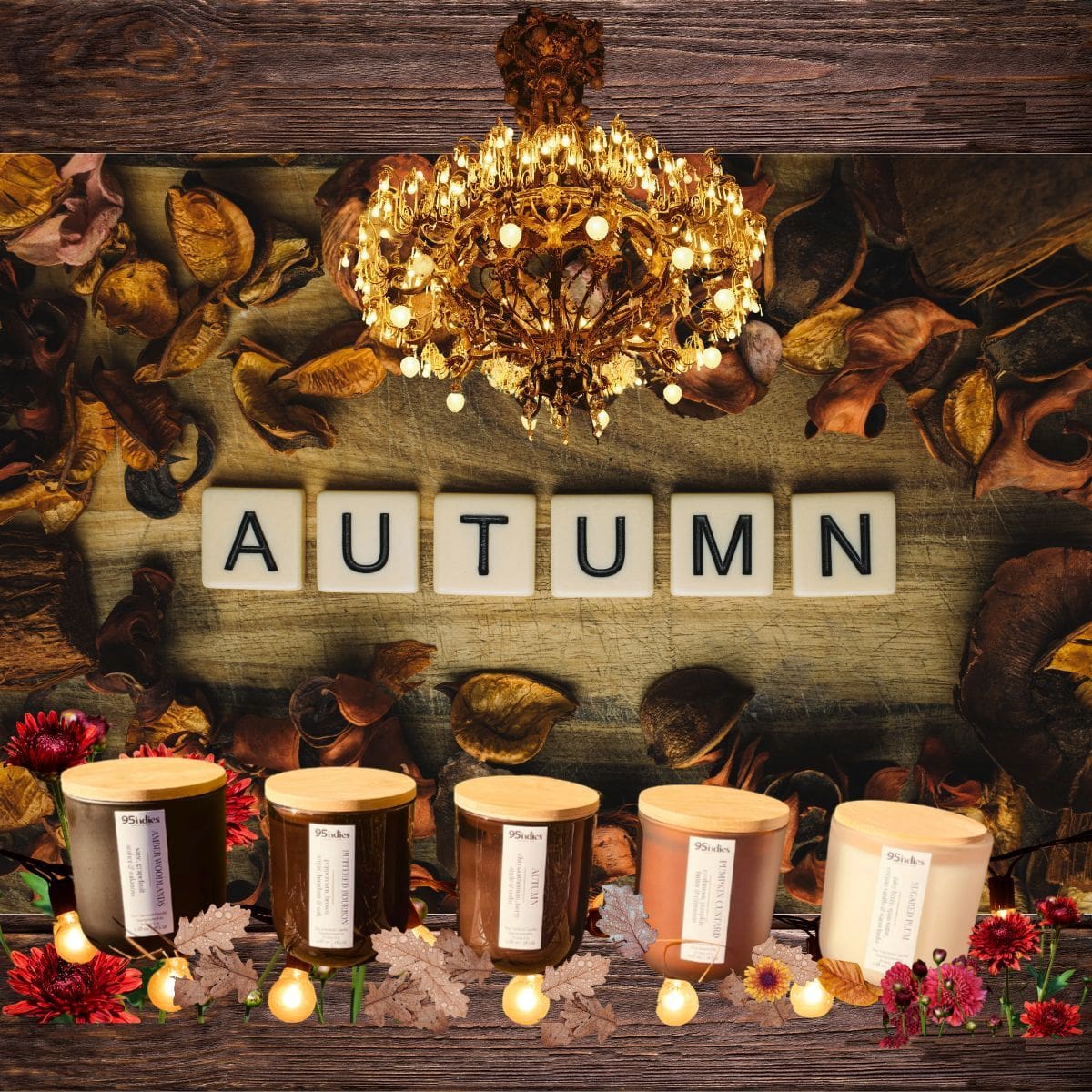 A cozy autumn showcase of 95indies candles — hand-poured in small batches to capture the warmth and richness of the season. Autumn candle collection displayed beneath a gold chandelier, surrounded by dried leaves and warm seasonal décor.