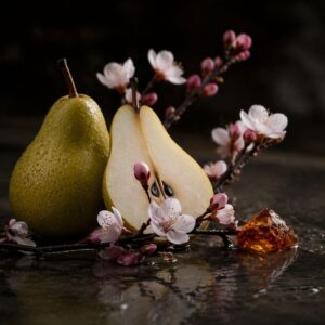Realistic still life of pear, cherry blossoms, and amber resin on a dark reflective surface with soft moody lighting