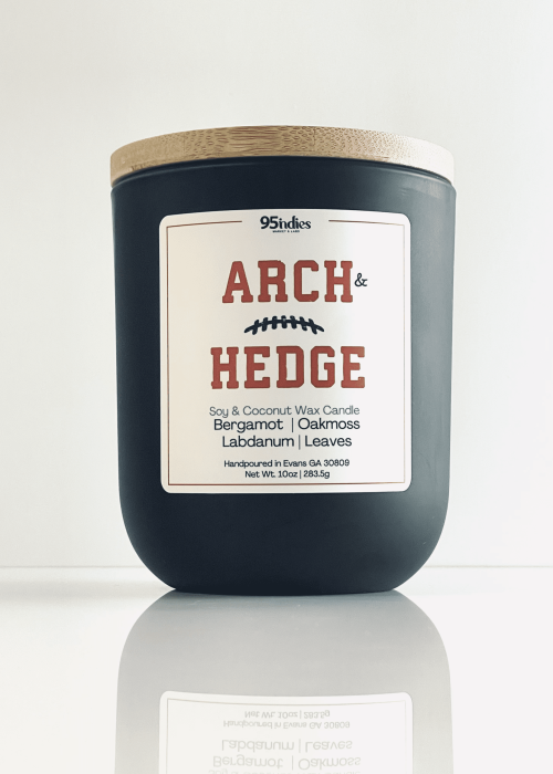 Arch & Hedge 10oz soy and coconut wax candle with matte black jar, bamboo lid, and rich fragrance notes of bergamot, oakmoss, labdanum, and leaves.